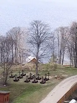 Site of the Church of John the Baptist (on Lake Seliger's shore behind the cemetery, now nonexistent), where the sculpture was originally in the lower church