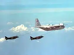 Harriers flying behind a tanker aircraft