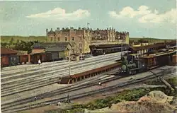 The former two-platform brick station building of Old English Gothic style in the 19th century