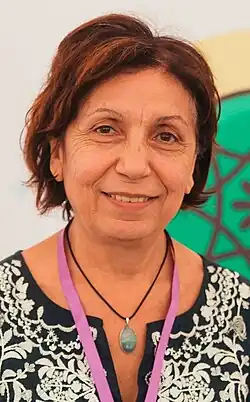 Headshot of Susanna Mkrtchyan at It Biler Forum. She is a middle-aged woman with brown hair wearing a patterned black dress.