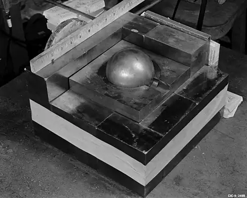 The sphere of plutonium surrounded by neutron-reflecting tungsten carbide blocks in a re-enactment of Harry Daghlian's 1945 experiment[36]