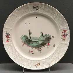 Plate with Green Landscape, c. 1778, Frankenthal, hard-paste porcelain, using Meissen's "Neuozier relief decoration on the lip.