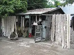 Leather goods and skins of Burmese python (Python molurus bivittatus) and reticulated python (Python reticulatus reticulatus) at a local shop at Mandalay, Burma